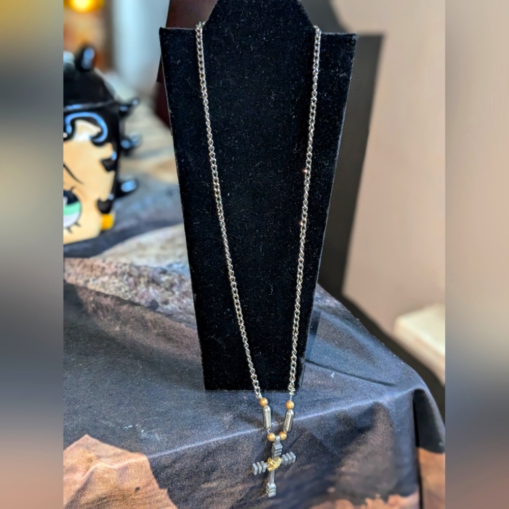Cross is made on the necklace